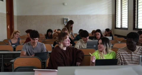 Mature teacher working with students inside classroom at school university Stock Footage 203727535