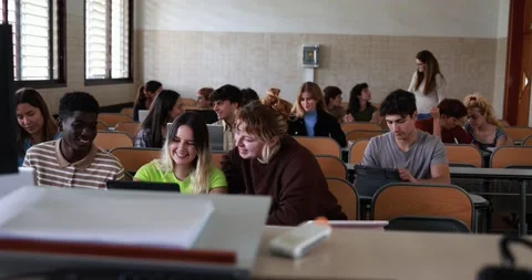 Mature teacher working with students inside classroom at school university Stock Footage 203727602
