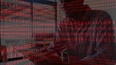 Mature technology developer typing laptop as red binary overlay floating, Stock Footage 315558199