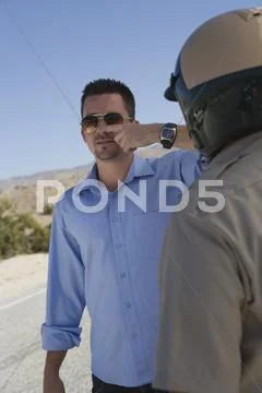Mature Traffic Cop Taking Sobriety Test Stock Photos