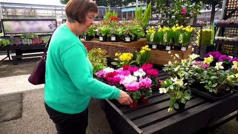 Mature White Caucasian Lady Shopping Portrait at Flowers Plants Gardening Stock Footage