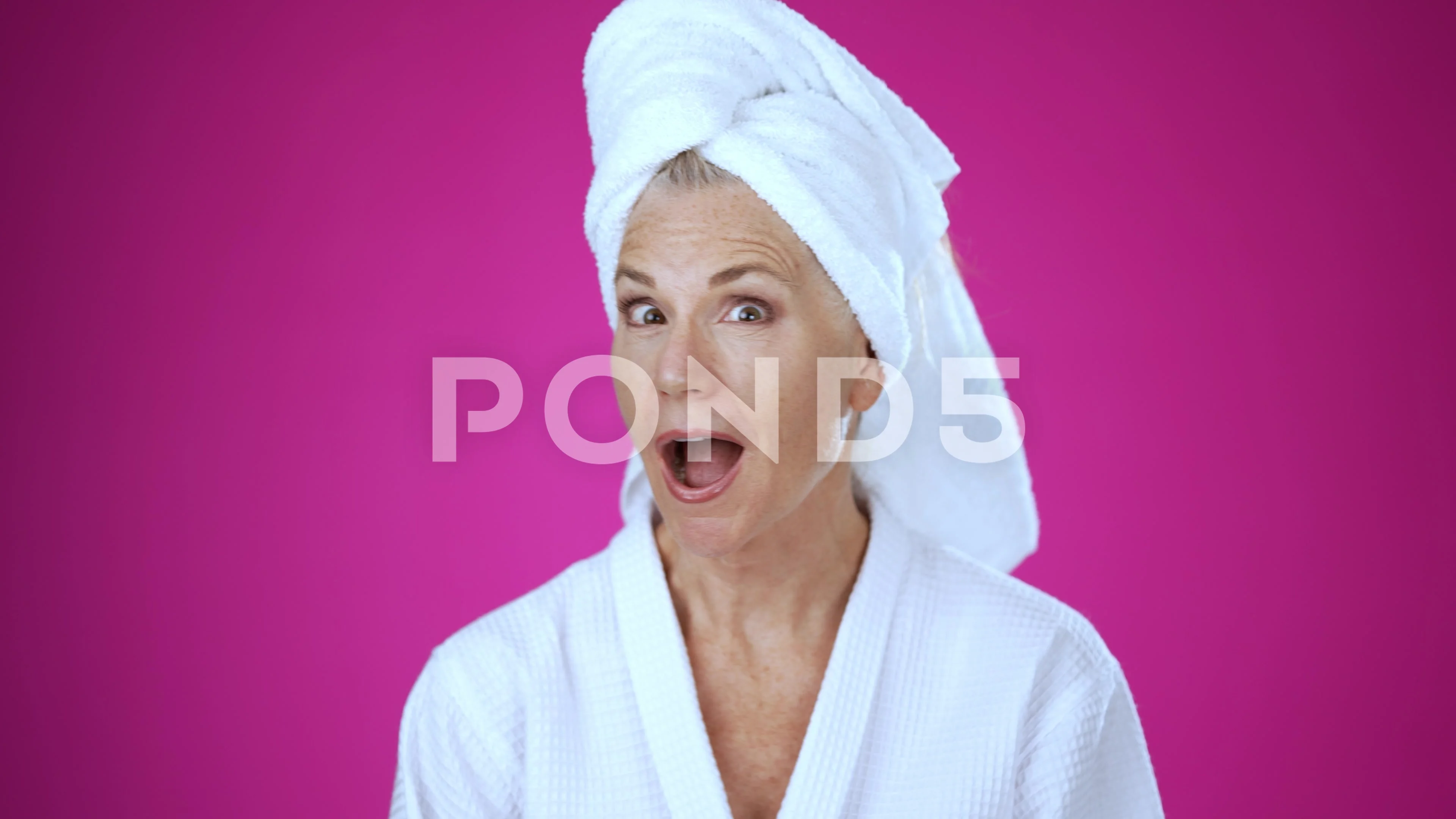 Mature woman in bath robe and towel on head out of shower shocked amazed  say wow