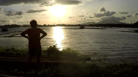 Mature woman Dance Exercise at lake shore. silhouettes Stock Footage