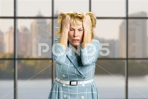 Mature woman in full desperation. Stock Photos