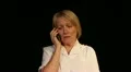 Mature woman gets bad news phone call HD Footage