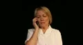Mature woman gets bad news phone call HD Footage