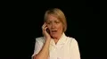 Mature woman gets funny gossip during phone call HD Footage