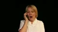 Mature woman gets funny gossip during phone call HD Footage