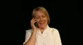 Mature woman gets good news phone call HD Footage