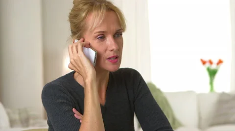 Mature woman talking on mobile phone Stock Footage