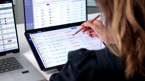Mature Woman Using Dual Touchscreen Laptop Stock Footage 340405084