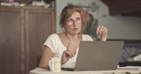 Mature Woman On A Videoconference At Home Stock Footage