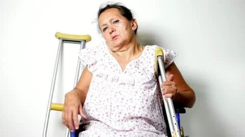 Mature woman in a wheelchair Stock Footage