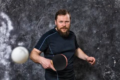 Matured bearded man plays table tennis studio portrait. Stock Photos