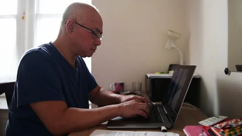 Matured man home working. Stock Footage 234613616