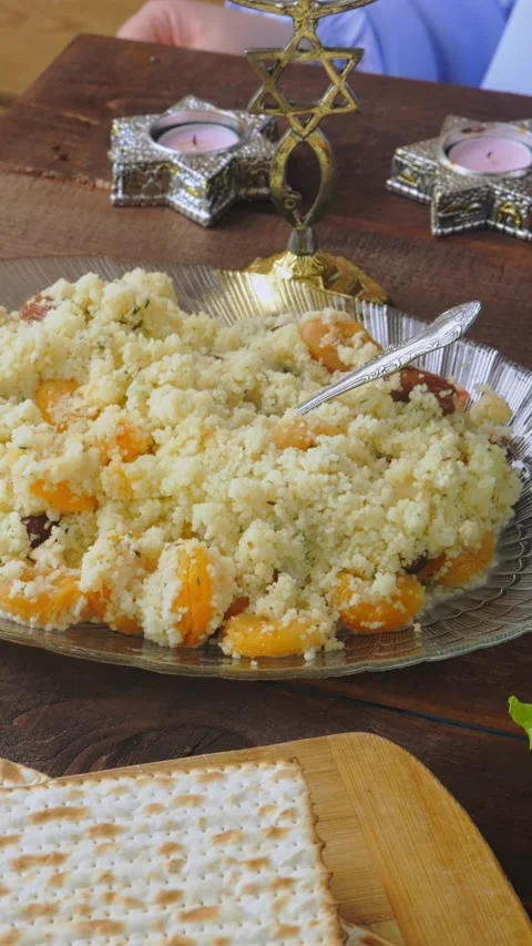 Matzo and menorah on the holiday table with traditional Passover Seder snac.. Video stock 272660405