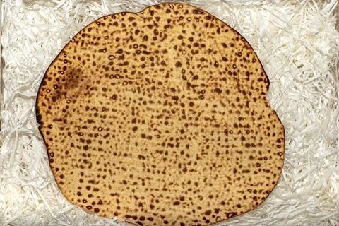 Matzo texture, a top view of a piece of traditional wheat dry bread served on Stock Photos