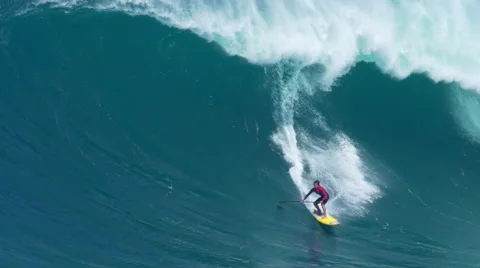 MAUI, HAWAII.  Surfers Ride Giant Ocean Waves Breaking Stock Footage 59198140