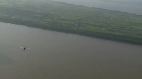 Maule flies over ocean Stock Footage 459952