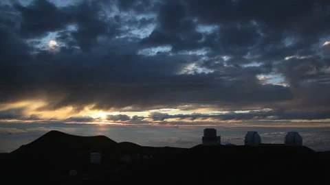 Mauna Kea Observatory at Dusk with Clouds and the Setting Sun Video stock 327295955