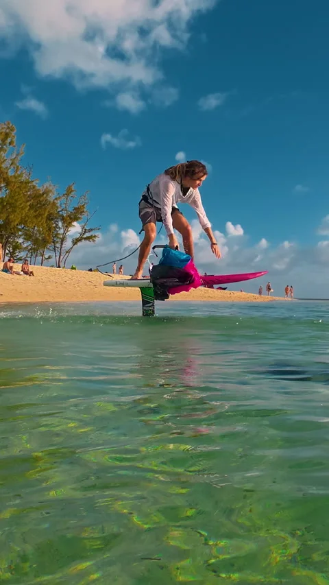 Mauritius, Le Morne - 03.03.2026: A man launches from the ocean shore on a Stock Footage 342992327