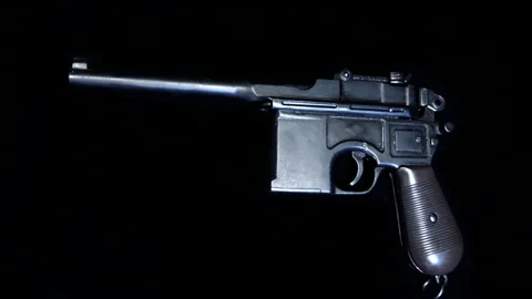 Mauser pistol on a black background. Shot in motion. Macro. Closeup Stock Footage 121606564