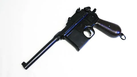 Mauser pistol on a white background. Shot in motion. Macro. Closeup Stock Footage 121606636