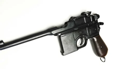 Mauser pistol on a white background. Shot in motion. Macro. Closeup Stock Footage 121606650