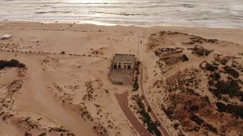 Mavic air Beach sand and a building 库存影片 171531869
