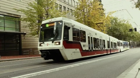 A MAX light rail train crosses the tracks in downtown Portland, Oregon Stock Footage 144188425