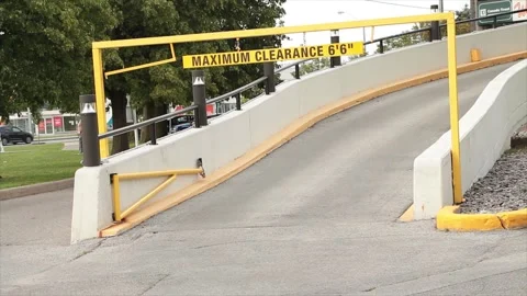 Maximum max clearance six feet foot six inches yellow bar at mall for upper ramp Stock Footage 249756317