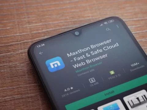 Maxthon Browser app play store page on the display of a black mobile smartpho Stock Photos