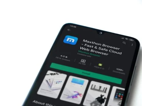 Maxthon Browser app play store page on the display of a black mobile smartpho Stock Photos