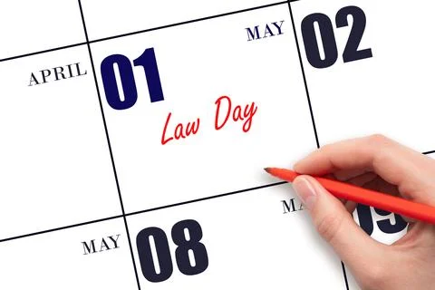 May 1. Hand writing text Law Day on calendar date. Save the date. Stock Photos