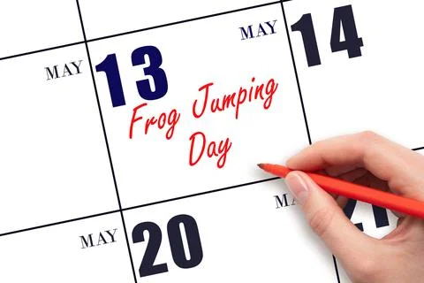 May 13. Hand writing text Frog Jumping Day on calendar date. Save the date. Stock Photos