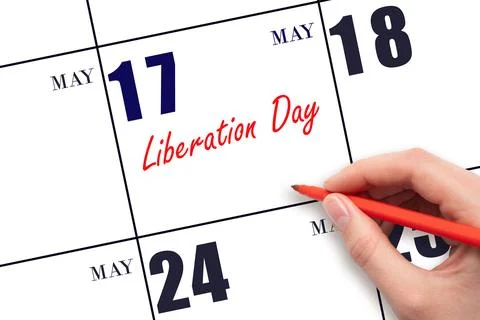 May 17. Hand writing text Liberation Day on calendar date. Save the date. Stock Photos