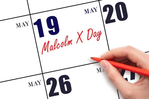 May 19. Hand writing text Malcolm X Day on calendar date. Save the date. Stock Photos
