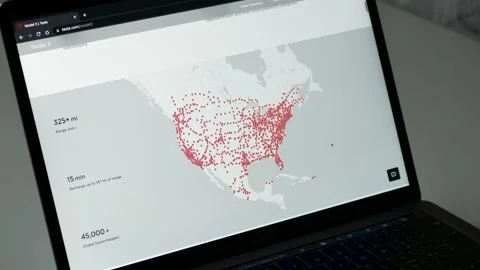 MAY 20, 2023: Visiting Tesla Official Website, Looking to a Model 3, on a Stock Footage 241661258