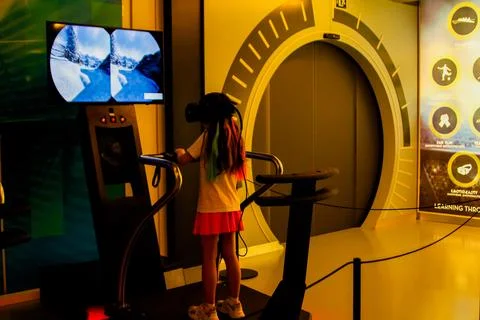 May 20, 2024. Spain, Manacor. Rafael Nadal Museum. Girl playing virtual reality Stock Photos