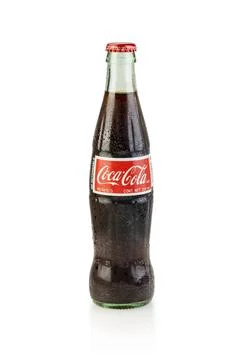 May 23, 2023 - East Rutherford NJ, USA - Glass bottle of COCA-COLA Refresco s Stock Photos