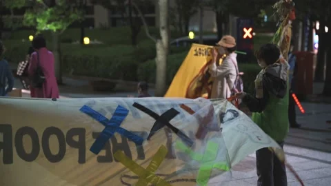 May 28, 2021 - Protest against the 2020/2021 Tokyo Olympics in Tokyo, Japan - 4K Stock Footage 154898163