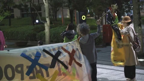 May 28, 2021 - Protest against the 2020/2021 Tokyo Olympics in Tokyo, Japan - 4K Stock Footage 154898239