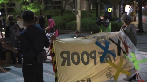 May 28, 2021 - Protest against the 2020/2021 Tokyo Olympics in Tokyo, Japan - 4K Stock Footage 154898277