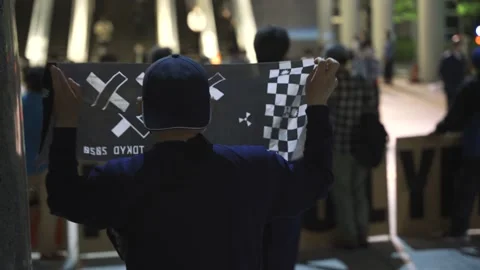 May 28, 2021 - Protest against the 2020/2021 Tokyo Olympics in Tokyo, Japan - 4K Stock Footage 154898310