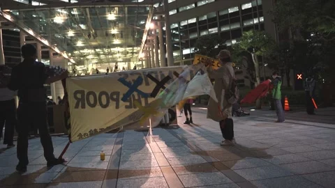 May 28, 2021 - Protest against the 2020/2021 Tokyo Olympics in Tokyo, Japan - 4K Stock Footage 154898351