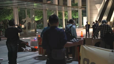 May 28, 2021 - Protest against the 2020/2021 Tokyo Olympics in Tokyo, Japan - 4K Stock Footage 154898413