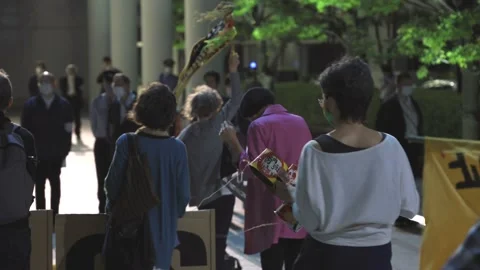 May 28, 2021 - Protest against the 2020/2021 Tokyo Olympics in Tokyo, Japan - 4K Stock Footage 154898436