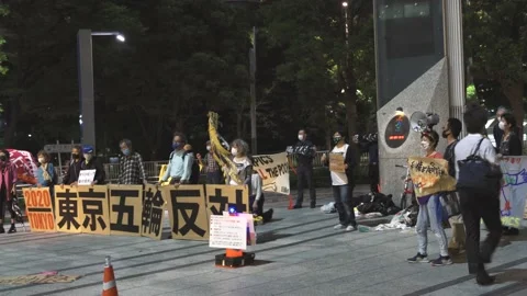 May 28, 2021 - Protest against the 2020/2021 Tokyo Olympics in Tokyo, Japan - 4K Stock Footage 154898474