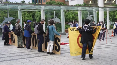 May 28, 2021 - Protest against the 2020/2021 Tokyo Olympics in Tokyo, Japan - 4K Stock Footage 154898509