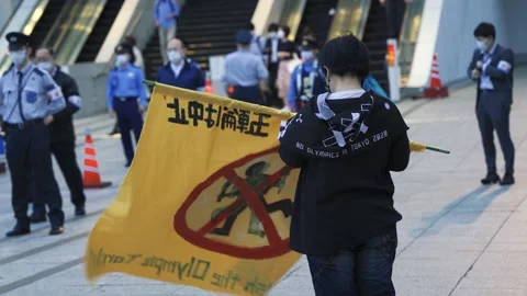 May 28, 2021 - Protest against the 2020/2021 Tokyo Olympics in Tokyo, Japan - 4K Stock Footage 154898535